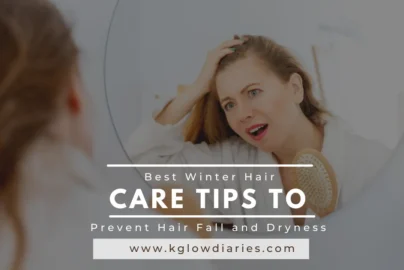 A woman looks into a circular mirror with a concerned expression while holding a hairbrush, featuring a text overlay that reads "Best Winter Hair Care Tips to Prevent Hair Fall and Dryness" and the URL "www.kglowdiaries.com."