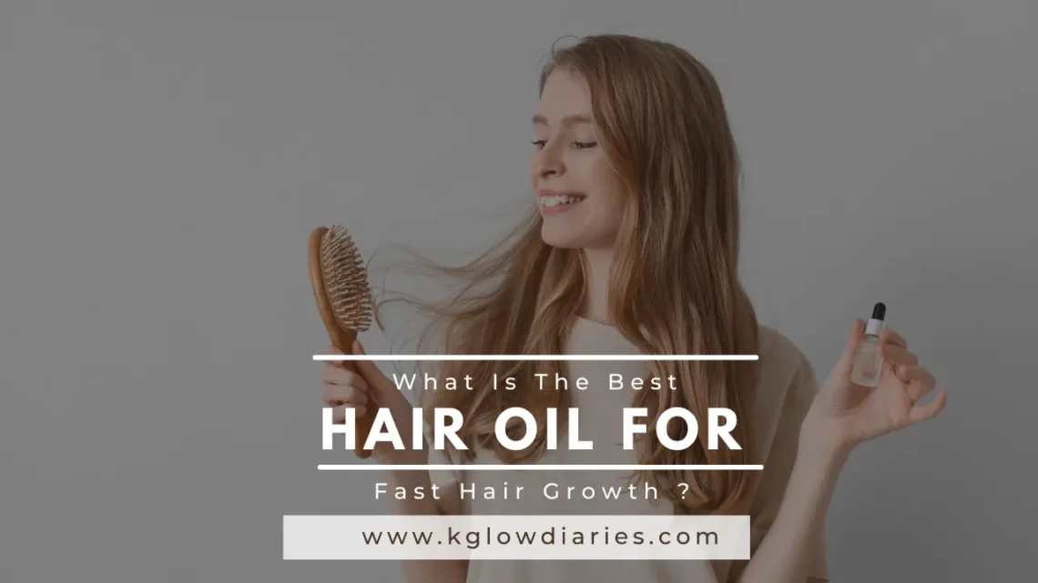 A smiling woman holding a wooden hairbrush and a small glass dropper bottle of oil; text overlay reads "What Is The Best HAIR OIL FOR Fast Hair Growth?"