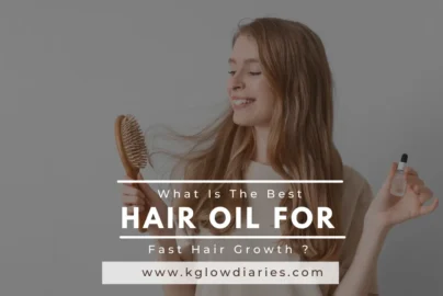 A smiling woman holding a wooden hairbrush and a small glass dropper bottle of oil; text overlay reads "What Is The Best HAIR OIL FOR Fast Hair Growth?"