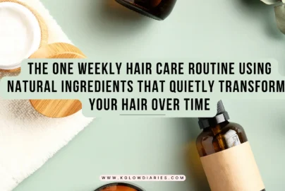 A flat-lay of natural hair care products including amber glass dropper bottles, a jar of white cream with a wooden lid, and fresh eucalyptus leaves on a light green background.