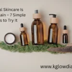 A collection of natural skincare products in amber glass bottles with wooden caps, including a pump bottle, a spray bottle, and two dropper bottles, arranged alongside a jar of white cream and green moss on a neutral background.