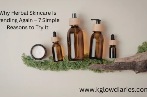 A collection of natural skincare products in amber glass bottles with wooden caps, including a pump bottle, a spray bottle, and two dropper bottles, arranged alongside a jar of white cream and green moss on a neutral background.