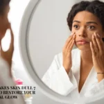A worried woman in a white bathrobe looking at her dull skin in a round bathroom mirror, overlaid with text about stress-related skin issues and remedies from K Glow Diaries.